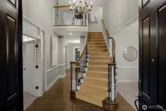 Grand staircase greets visitors, as well as recently refinished hardwoods