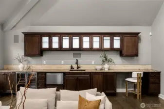 Entertainment room has a wet bar, dishwasher & wine fridge