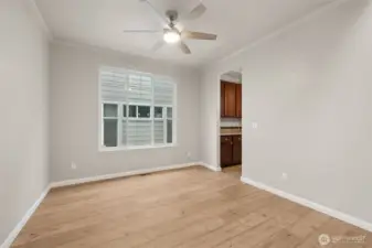 This angle really shows how polished this formal dining room feels. From the entry, your eye is drawn straight across the room to the butler’s pantry, which makes the whole space feel connected and intentional. The oversized window brings in generous natural light, while crisp white millwork and crown molding frame the room and add just the right amount of formality. It’s elegant without feeling stiff, and flexible enough to work as a dining room, front living space, or something in between.