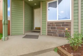 A welcoming covered entry and architectural accents create a polished first impression. Thoughtful exterior details reflect the care and quality found throughout the home.