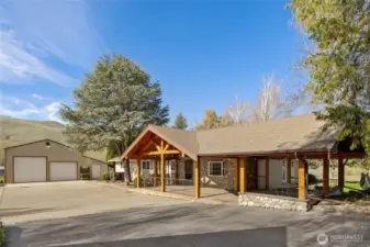Covered stamped concrete patio with open beamed ceiling