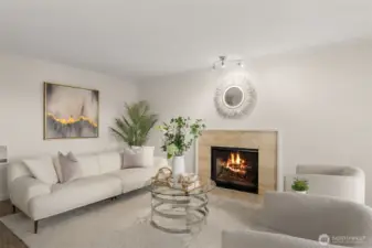 Bright living room with cozy fireplace and Lake Union views.