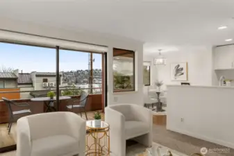 Spacious living area with partial views into the dining area and kitchen