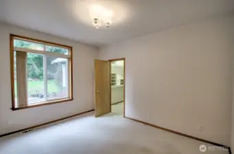 Split-bedroom floor plan offers two additional bedrooms on the other wing of the house with bathroom between.