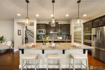 Large kitchen with walk-in pantry and room for 3 stools