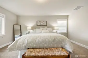 Step upstairs to the Primary bedroom (King size bed shown)