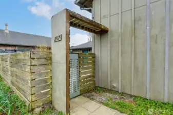 Exterior of the residence. Fenced front courtyard near town in Long Beach, Washington.