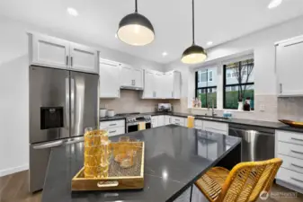 Double door fridge and electric stove, thee cottages are energy efficient with a 0 HERZ rating and a zero carbon footprint.