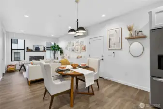Wall of shiplap surrounds the electric fireplace with mantle.