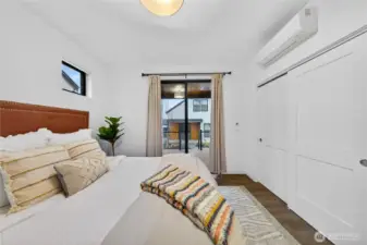 Glass doors leading to the covered deck off the main level owner's suite.