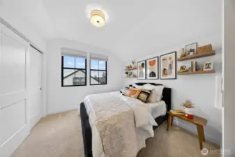 One of the two upstairs bedrooms with large closet space.