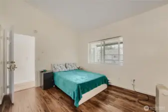 Spacious primary suite with abundant light.