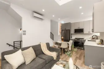 Peek the stairs and built-in efficiency—this home was made for seamless movement and comfortable living. And that mini-split? Quiet and efficient!