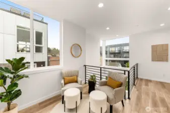 Upstairs moment of calm: curl up in your sun-soaked nook. Work corner? Reading spot? You decide.