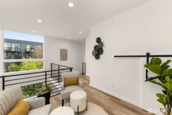 Natural light pours in from every angle here. This lofted flex area is your blank canvas for creativity.