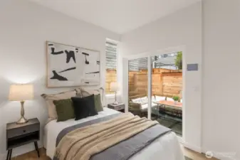 This bedroom opens directly to your private patio—a weekend coffee spot officially secured.