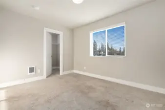 Bedroom with walk-in closet.