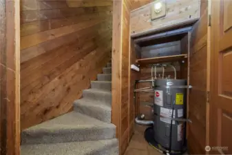 Stairway to the upstairs bedrooms is enclosed behind a door from the living room