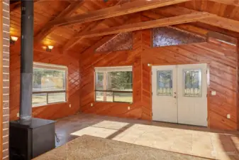 This living room is flooded with natural light from the large windows and the high peaked accent windows. The effect is quite dramatic, and really opens up the space.