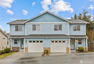 (on right) Single garage and room for two vehicles in the driveway.