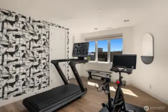 The second en-suite bedroom has been repurposed as a personal work out room.