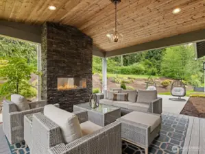 Covered Deck with stone wall fireplace