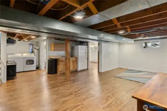 Basement with laundry room and partial kitchen.