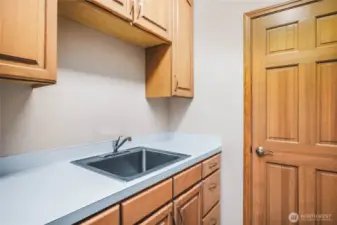 Laundry room with sink and extra storage
