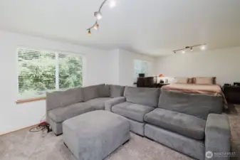 Full size sectional fits in one half of this bedroom which also includes a king size in the background.  This room is SO BIG!