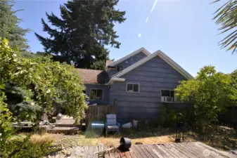 Deck and back yard with fruit trees.