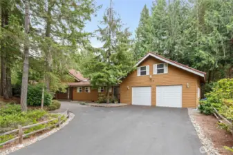 Located at the end of a cul-de-sac, the front of this home feels nestled in the beautiful Lakeland Village landscape.