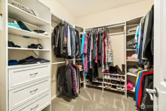 Primary closet with custom closet organizers
