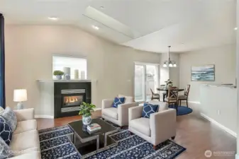 Vaulted ceilings and skylights create a spacious feeling. Cozy gas fireplace for warm winters!