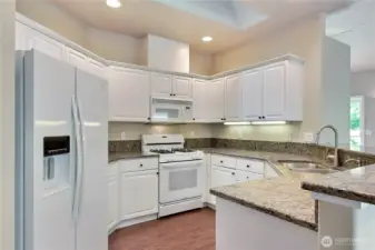 Granite counters throughout kitchen and bathrooms.