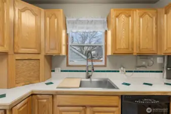 Large updated stainless steel sink and faucet.