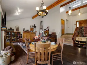 The tall Ceilings and warm wood beams give this home character and charm.