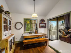 There is room for a large farm table and the access to the deck is conveniently located through large sliding doors.