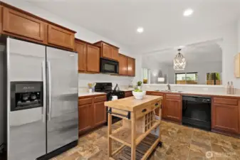 Semi-open concept, where you can still engage with guests, but they won't see the dishes in the sink while you're hosting!