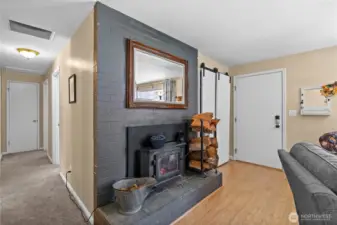 The wood burning fireplace can heat the entire house in the winter and features an electric fan to disburse the heat.