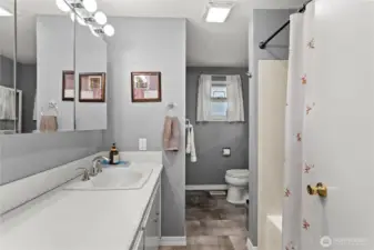 The full-sized bath is centrally located.