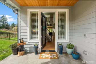 Venture into this covered patio entrance to the foyer of your dreams.