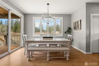 Flooded with natural lighting, enjoy this extra space designated for dining with access to the covered patio deck through an additional set of sliding glass doors.