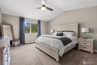 High ceilings and lots of space, this primary bedroom is a dream come true.