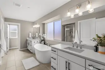With a double vanity and closets, this en-suite bathroom meets every couples' storage needs!