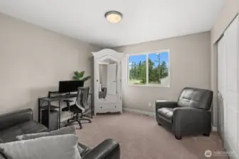 This secondary bedroom is currently curated as a sophisticated home office, illustrating the home’s adaptability to your lifestyle needs