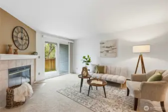 Cozy living room with fireplace and abundant natural light