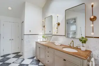 Upper level bathroom with marble floor tiles