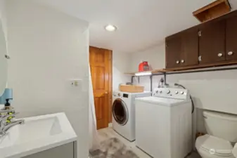 laundry room and 3/4 bathroom on the lower level. The pool is beyond the door