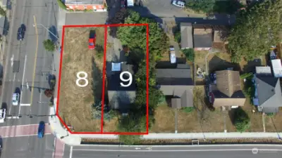 Lot #9 is red house. Lot #8 is available for sale.