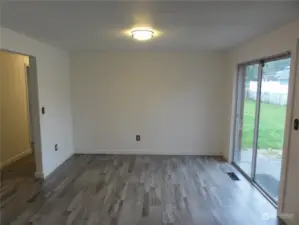 Eating area with sliding glass door leading to patio and back yard.